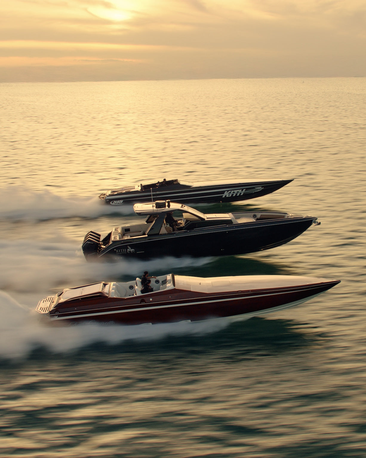 Three Cigarette × Kith performance boats running together across the water in golden light