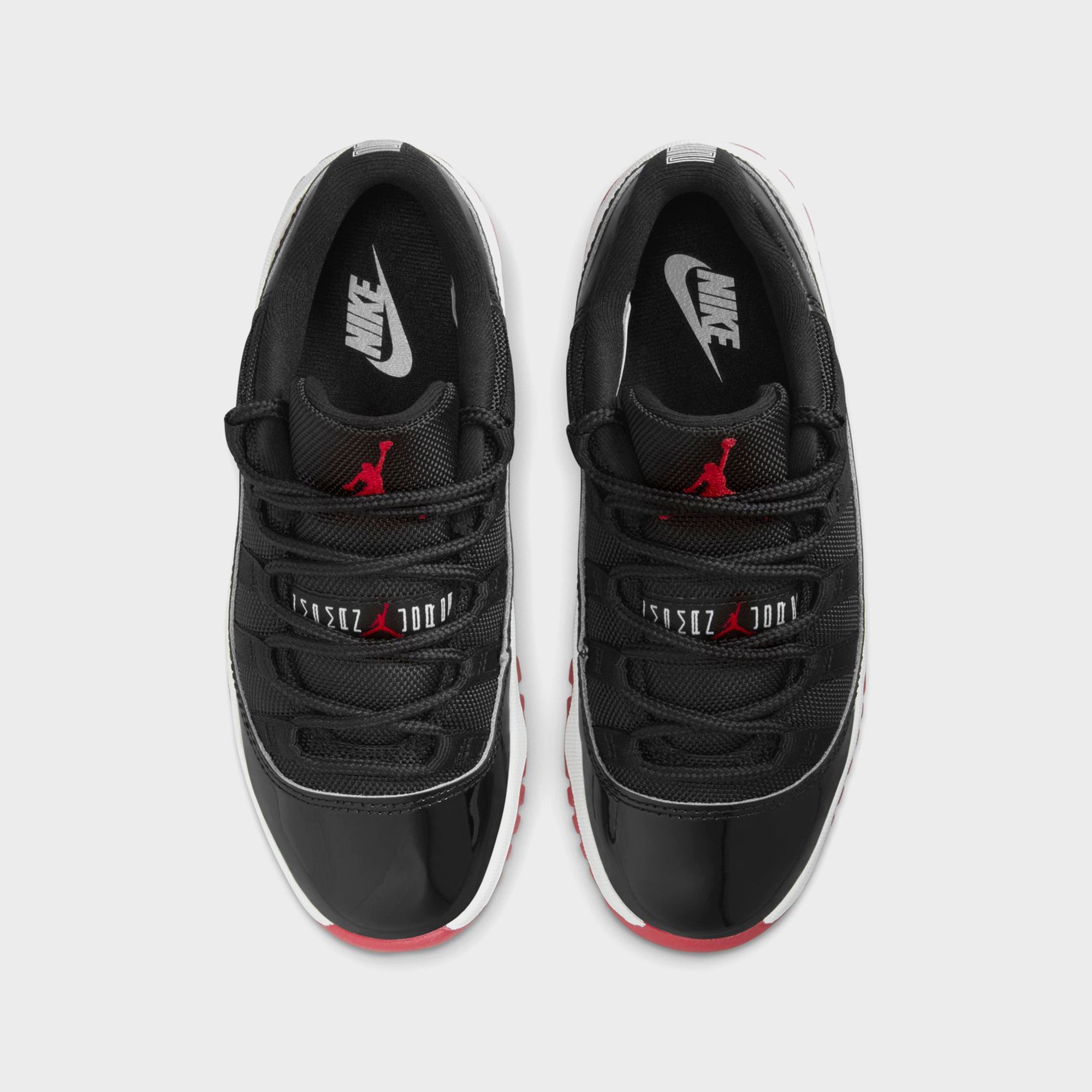 jordan 11 low top red black and white