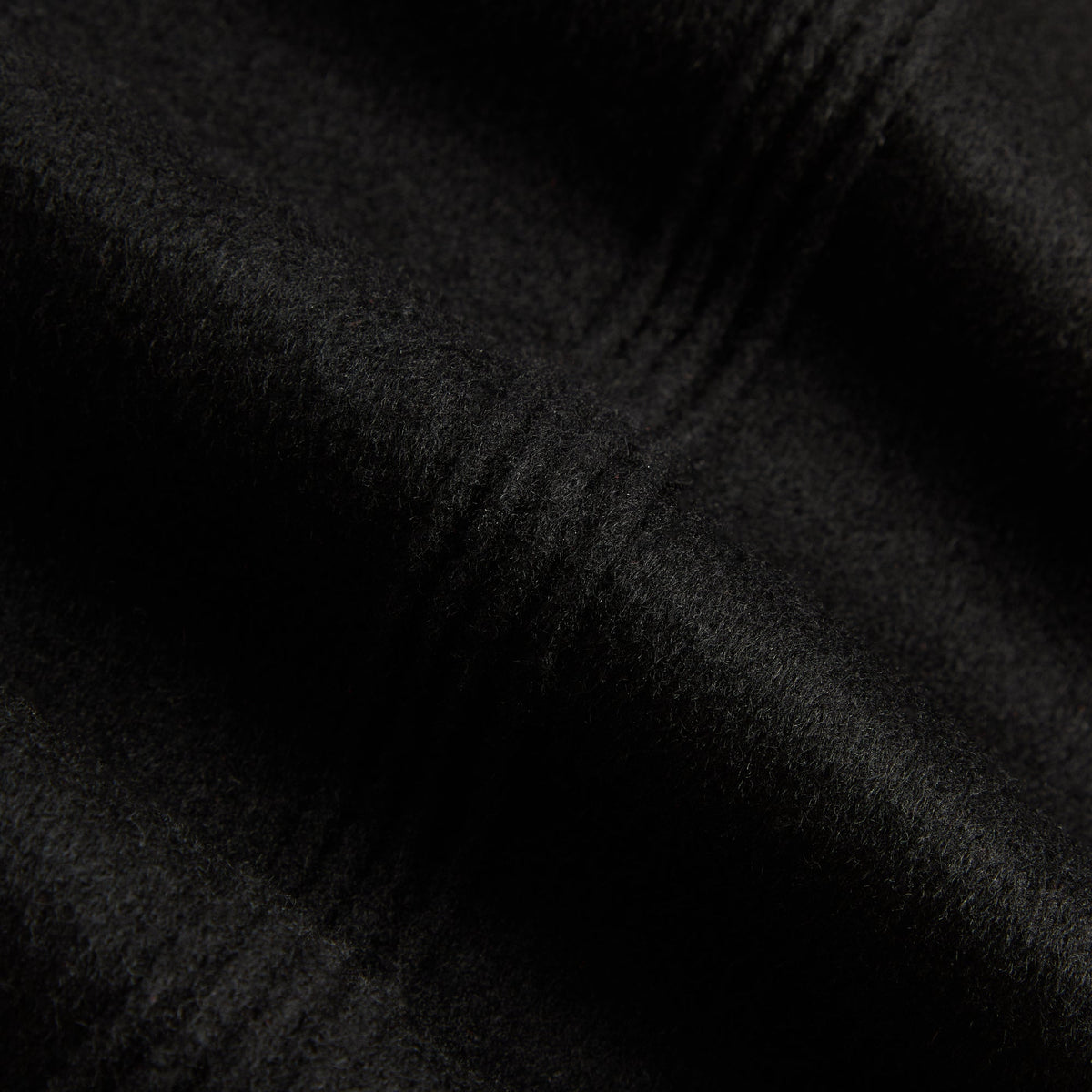 Close-up of black double-face wool fabric of the Kith Wes jacket