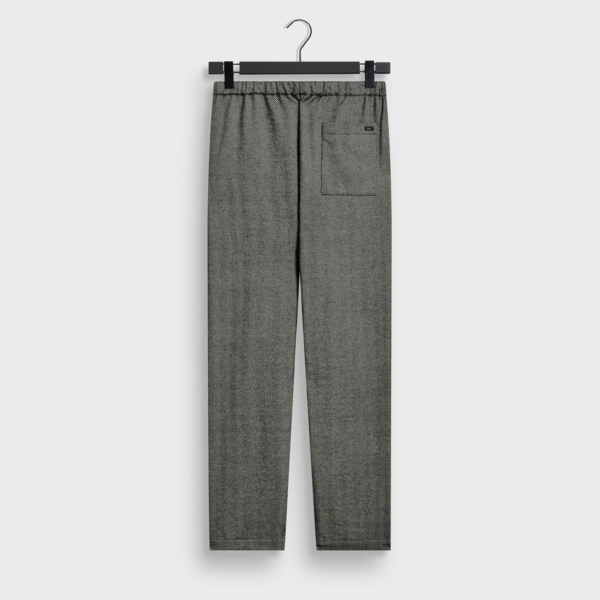 Kith Chenille Herringbone Grayson Pant in herringbone, back view, with welt pocket