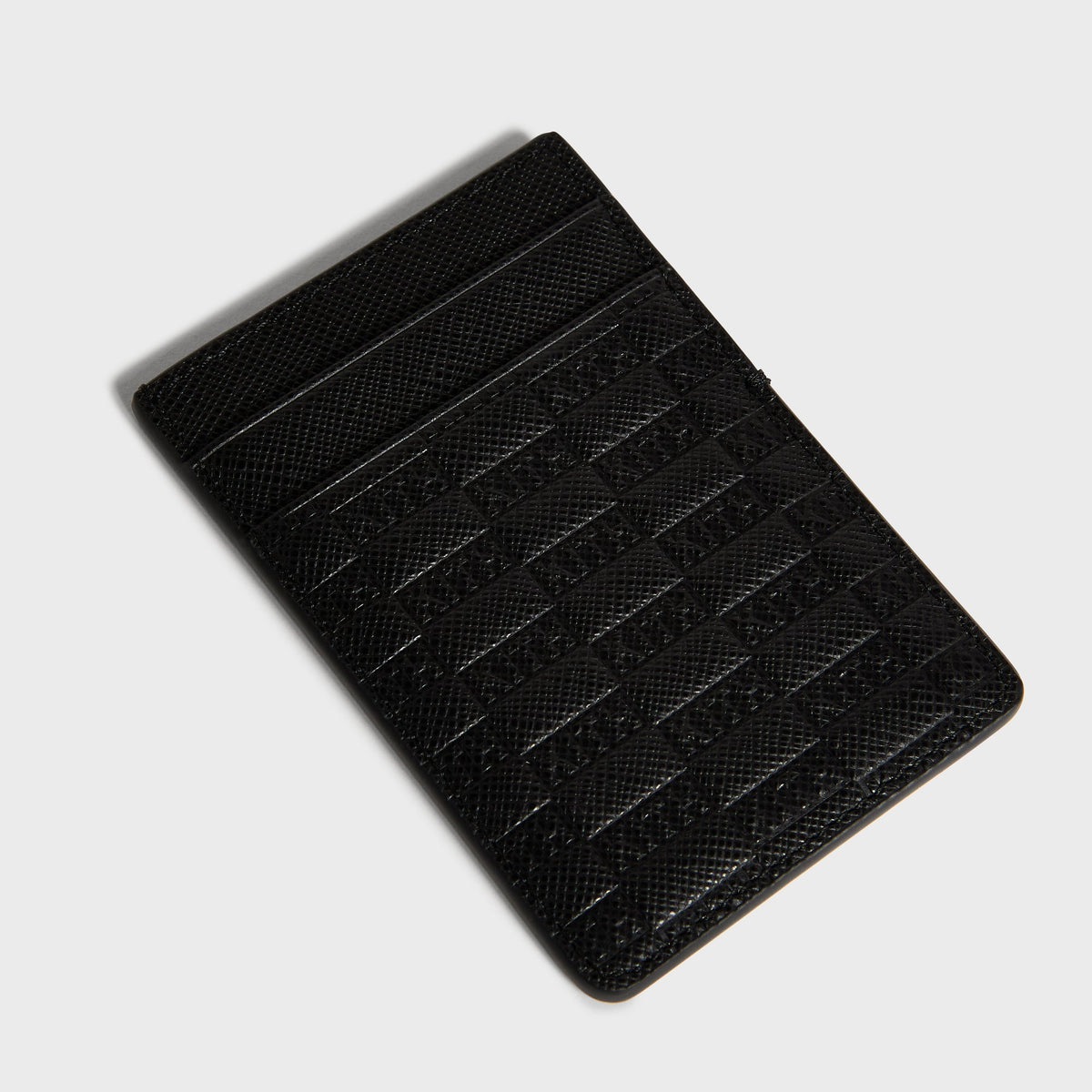 Black Kith Magsafe leather wallet, angled view, with KITH monogram embossing